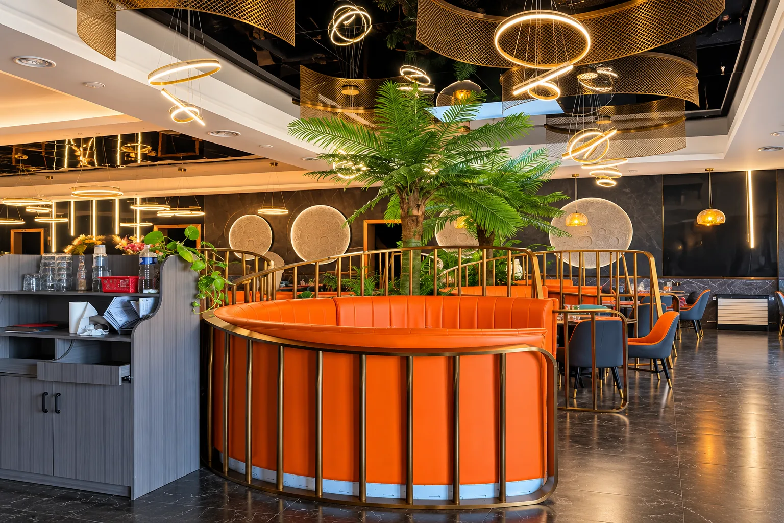 A rounded banquette and a palm tree.